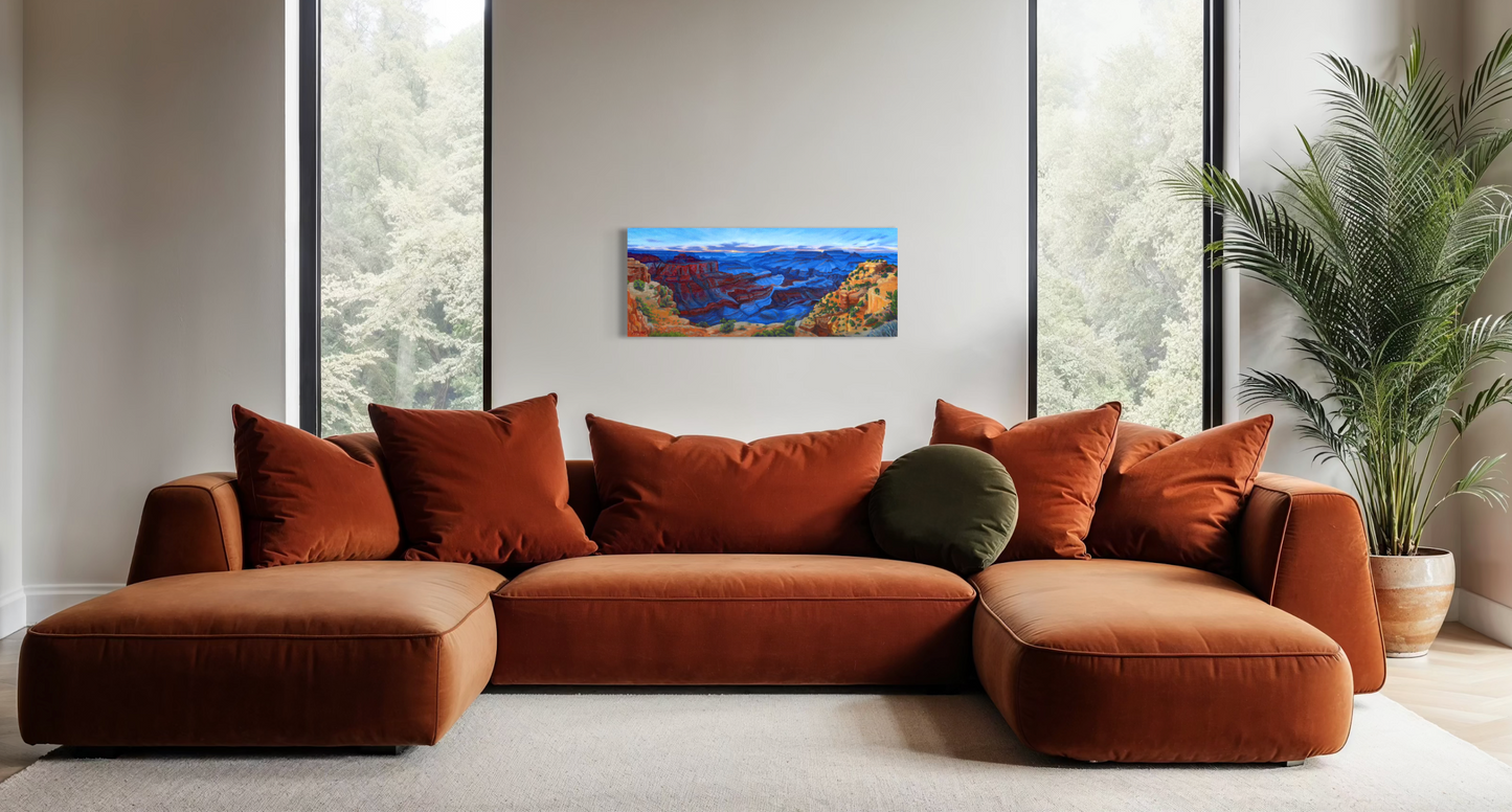 Brown sectional sofa with decorative pillows in a living room setting. A colorful grand canyon painting is on the wall.