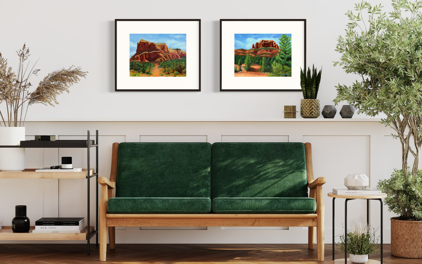 Green sofa in a living room with framed artwork on the wall
