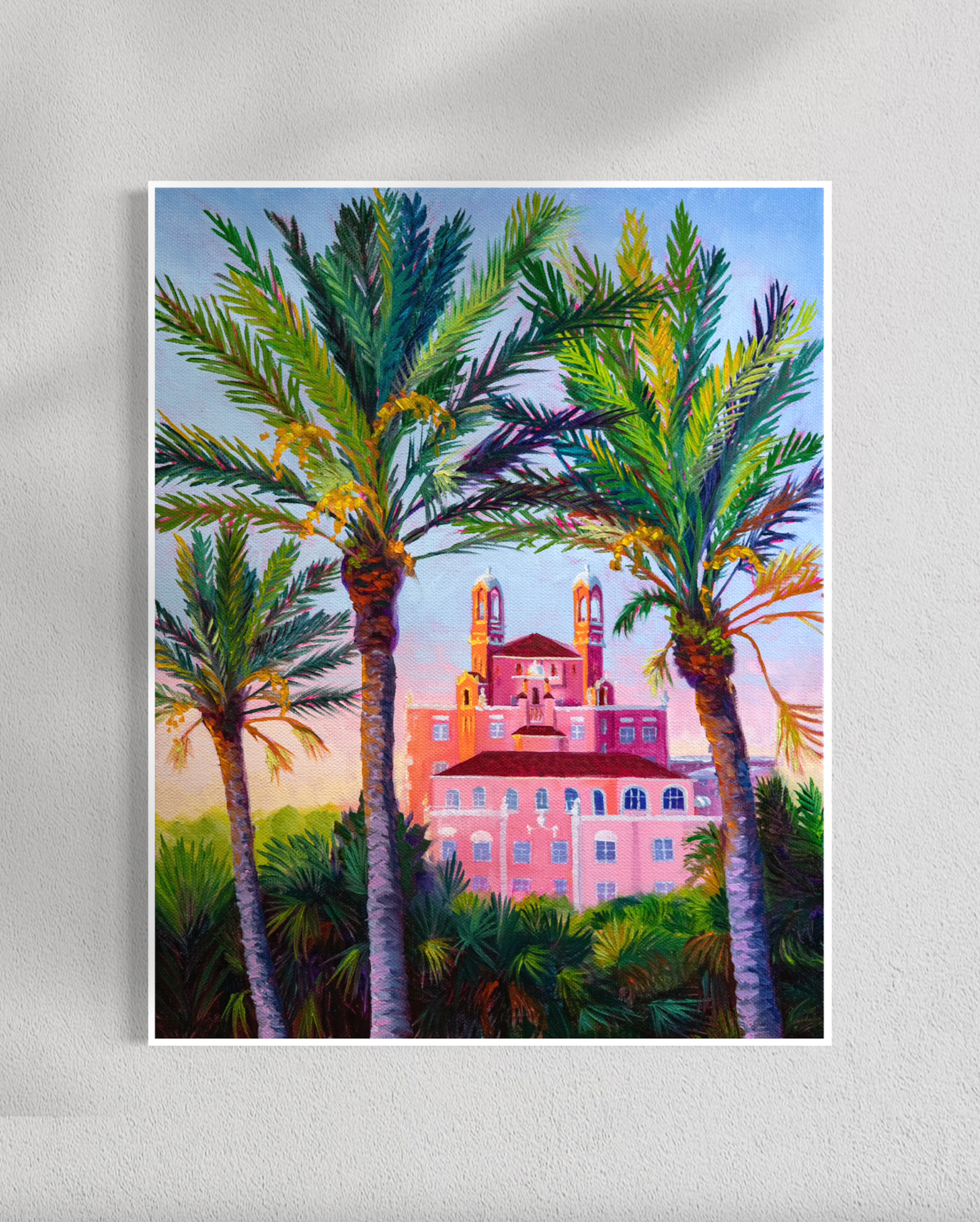 paper print of a pink building with palm trees on a .25 inch white background