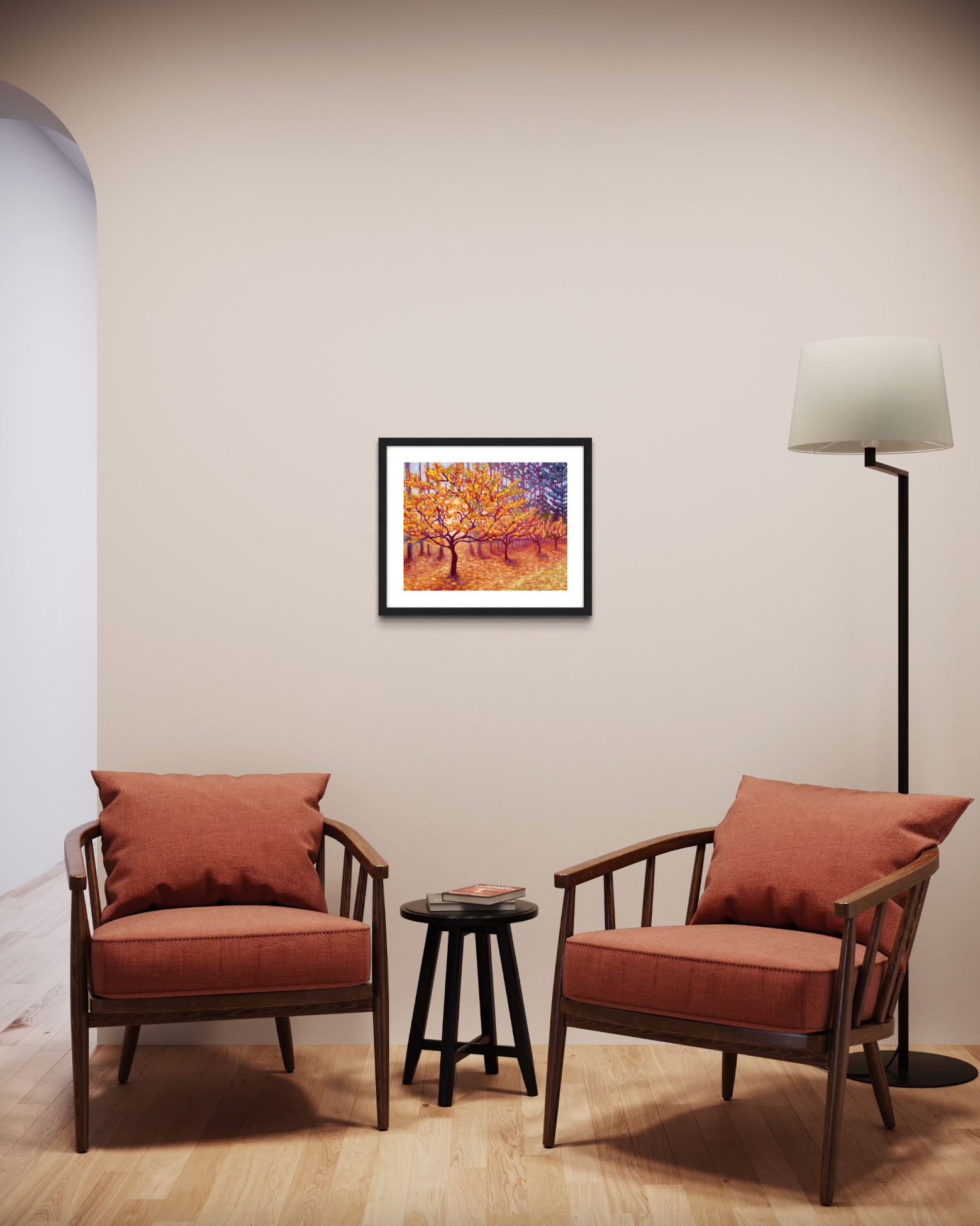 Two brown armchairs with cushions in a room with a framed picture of trees with golden leaves on the wall.