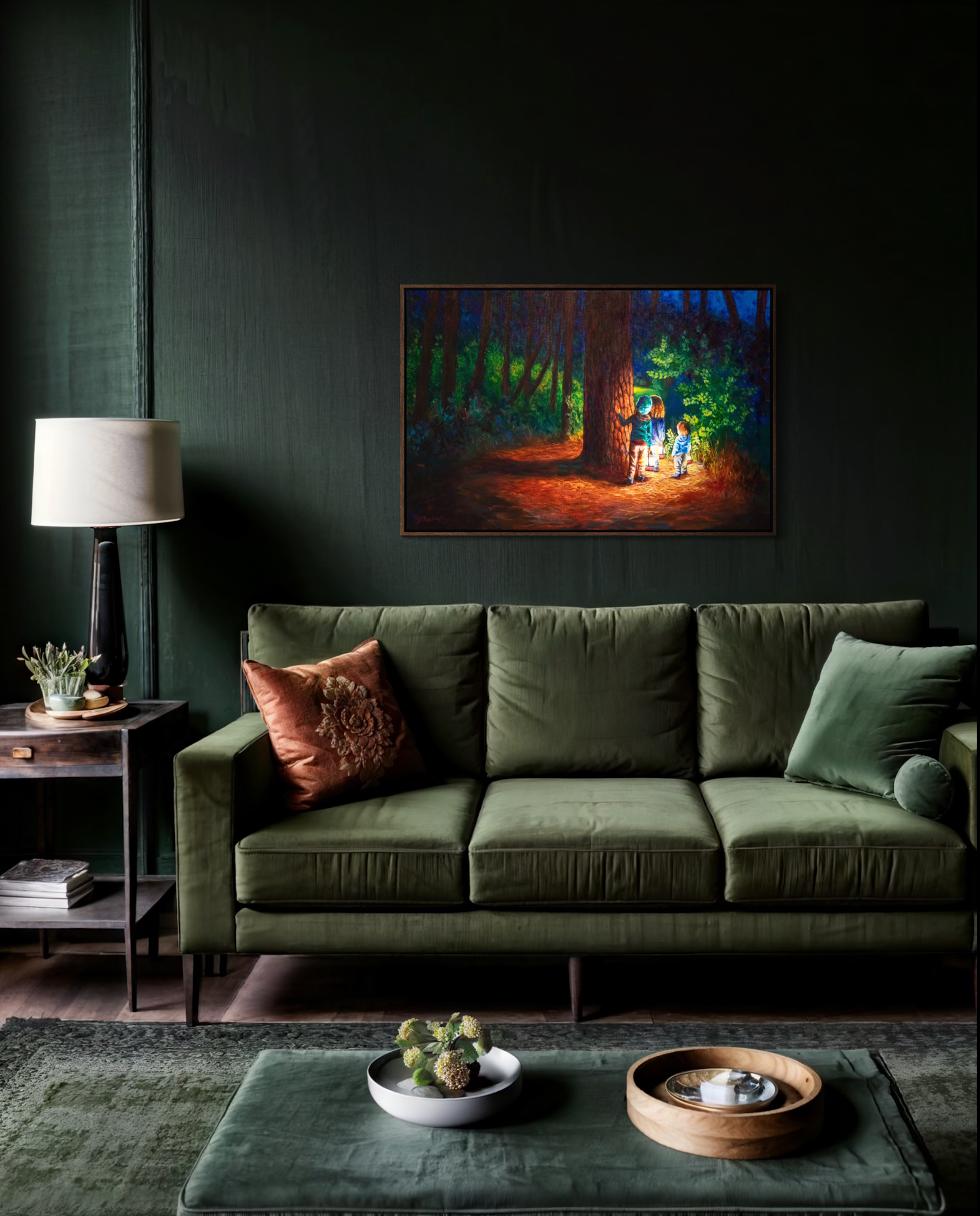 Green sofa in a living room with a dark wall, lamp, and decorative items. A framed painting of children in the forest with lanterns hangs on the wall.