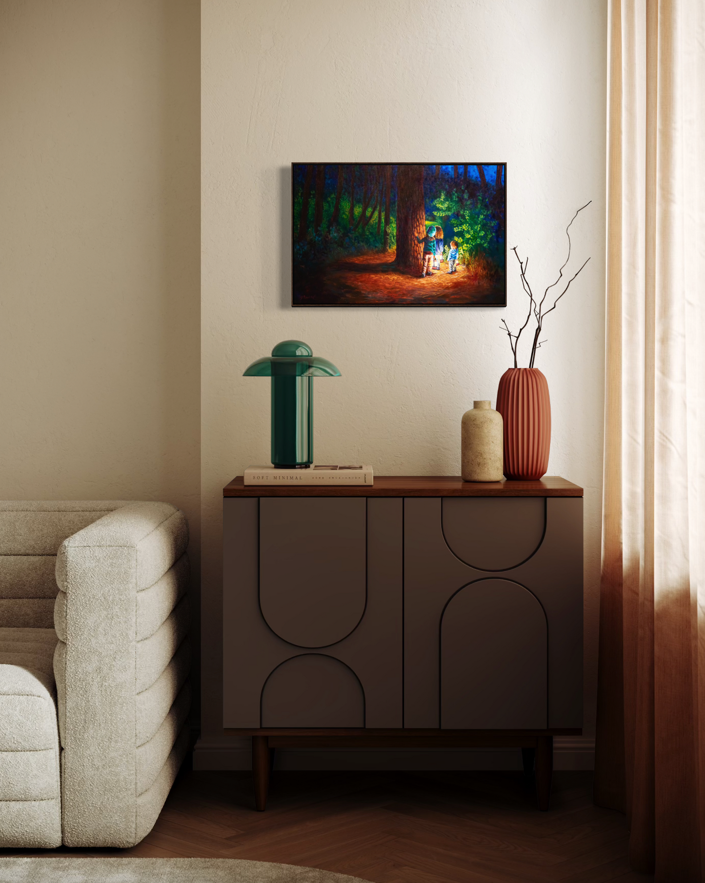 Modern living room with a painting of a forest scene on the wall, a sideboard with decorative items, and a sofa.
