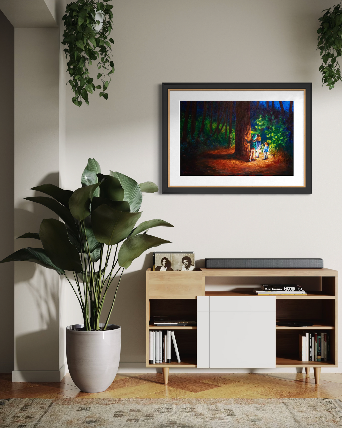 Living room with a framed artwork on the wall, plant, and wooden entertainment console.