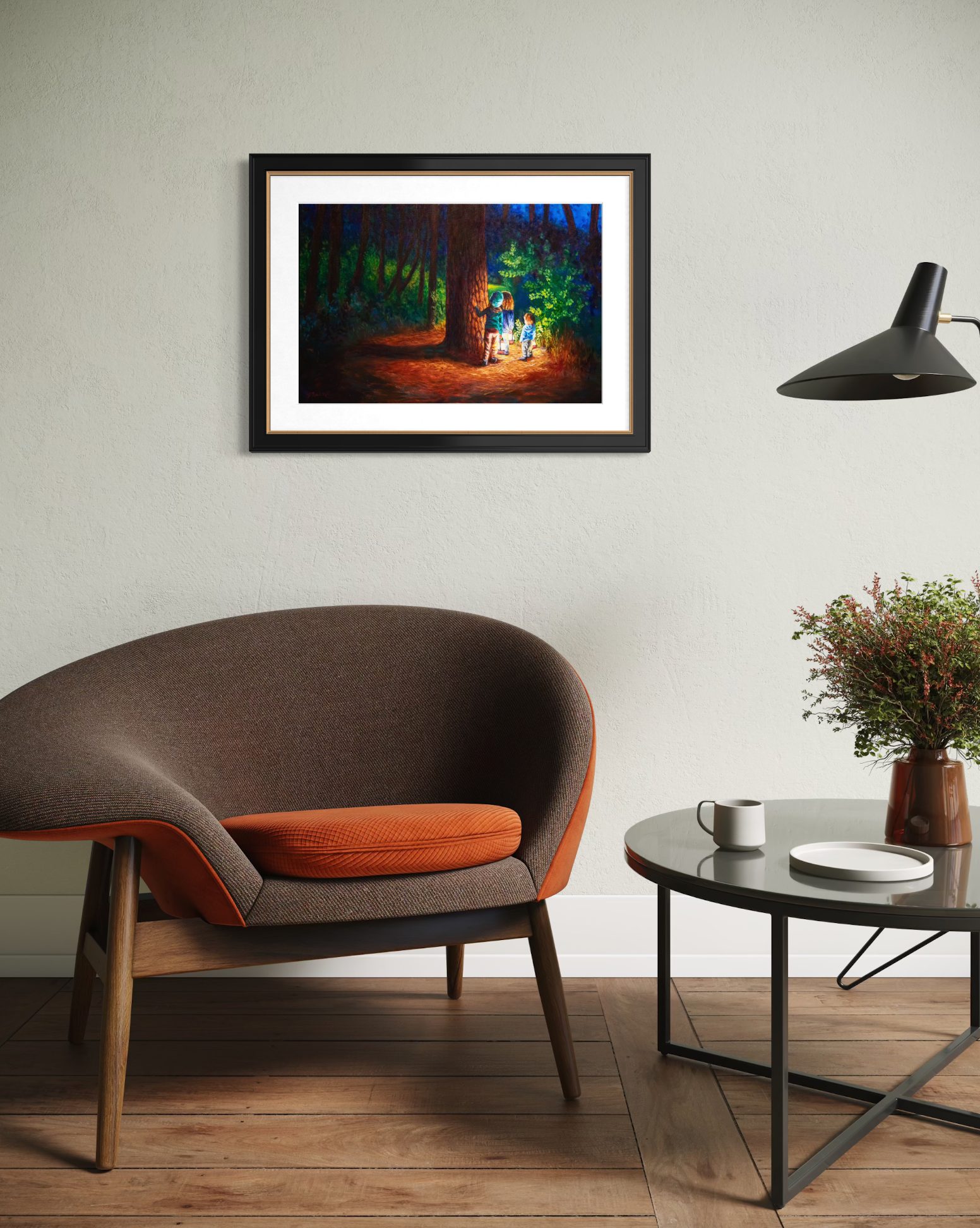 Framed artwork on a wall above a modern chair in a living room setting.