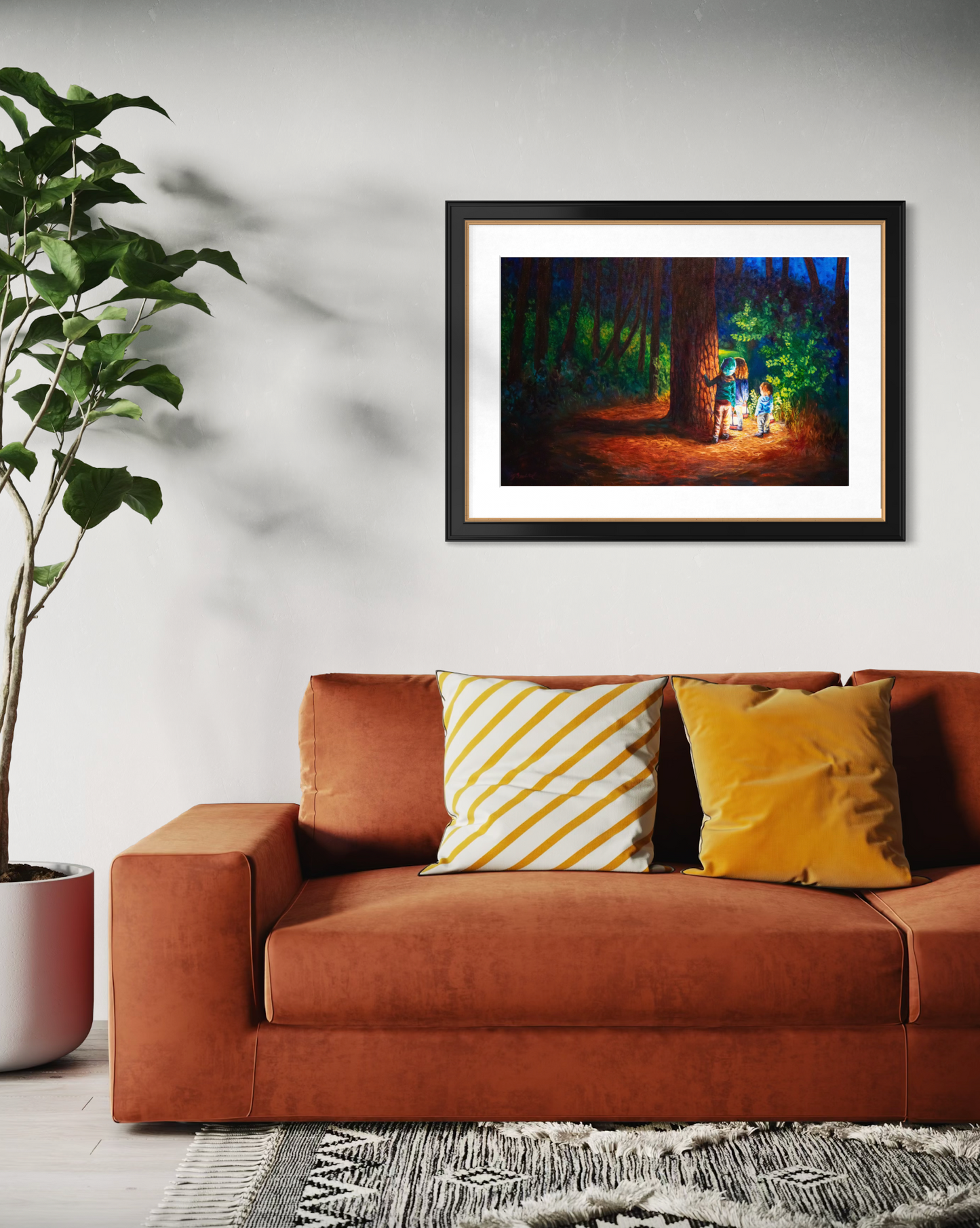 Framed artwork above a brown sofa with decorative pillows in a living room setting.