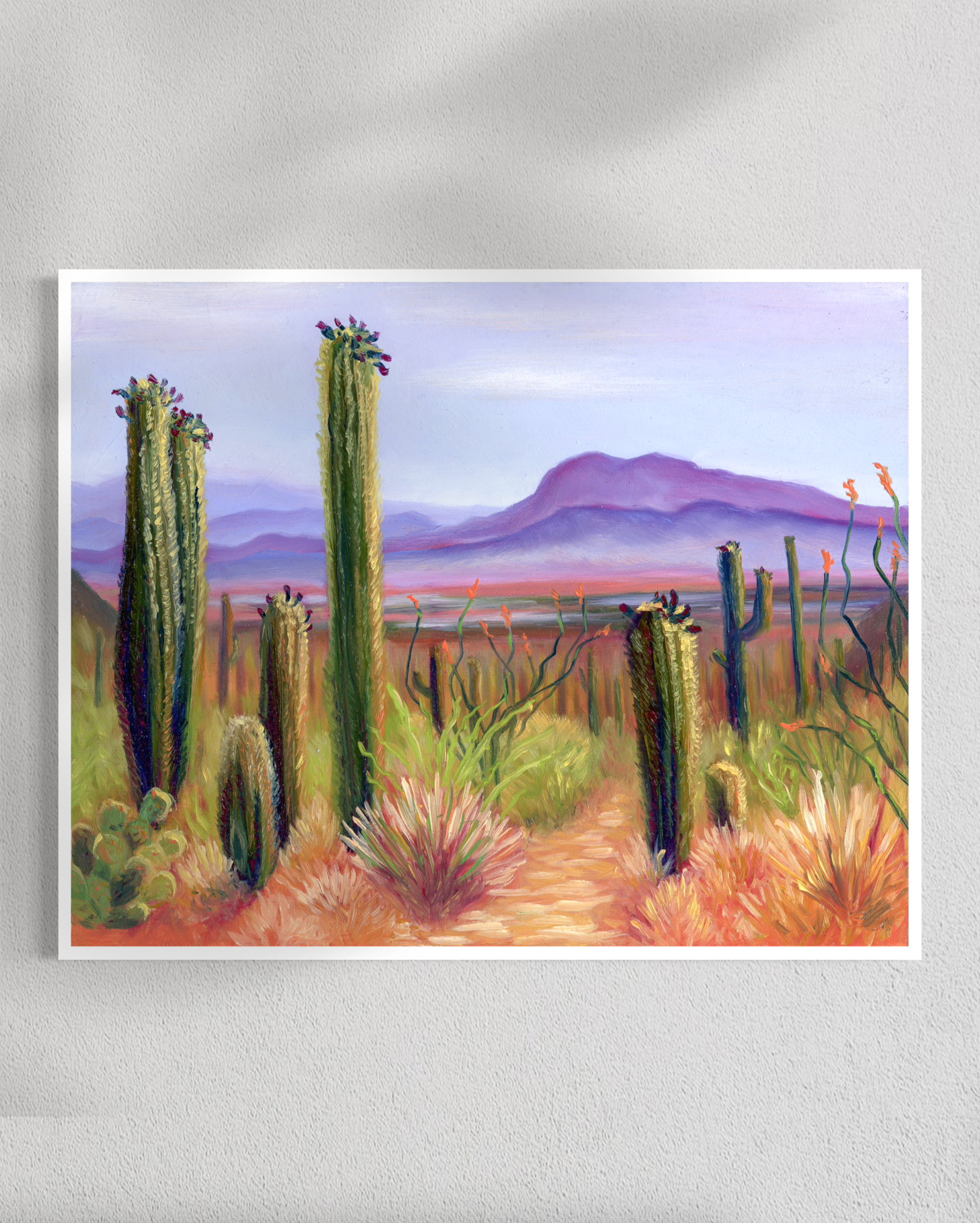 Painting of a desert landscape with cacti and mountains.
