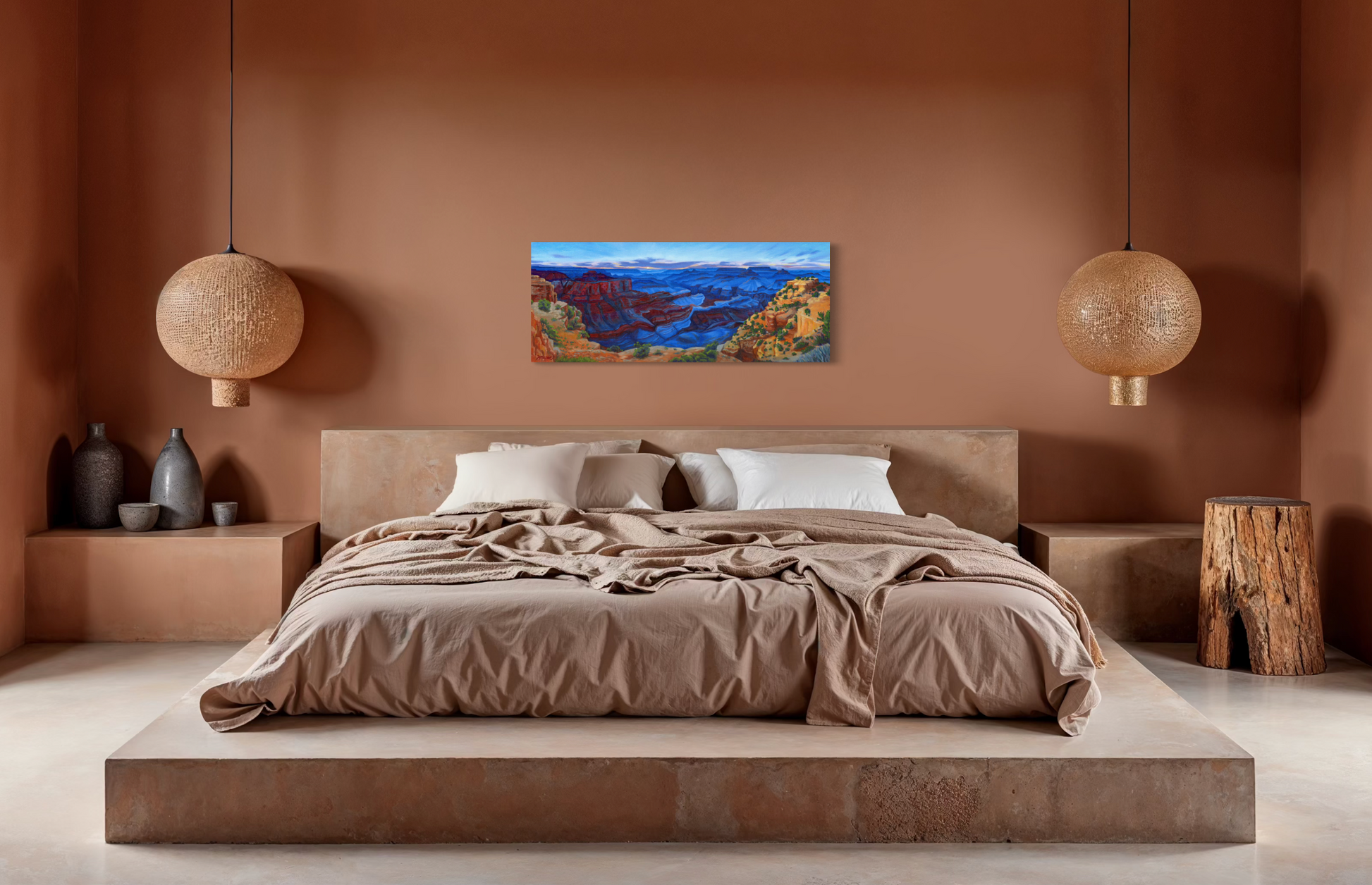Modern bedroom with a bed, wall art of colorful blue canyon painting, and decorative items.