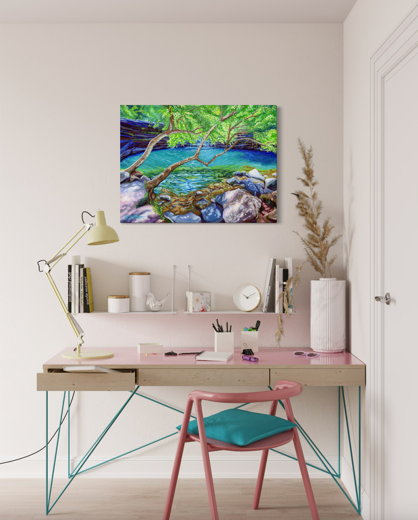 Modern home office with a desk, chair, and artwork on the wall.