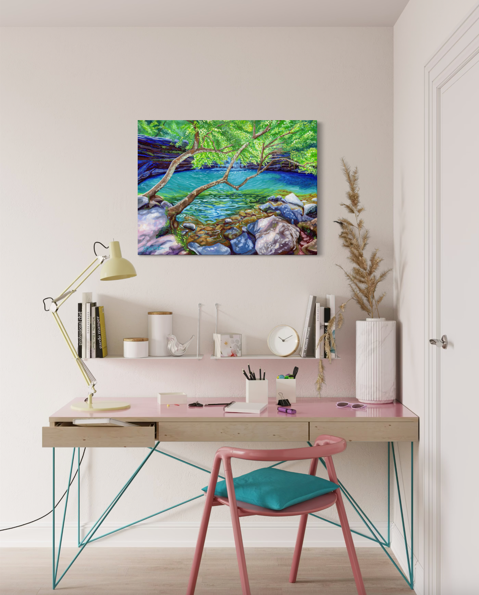 Modern home office with a desk, chair, and artwork on the wall.