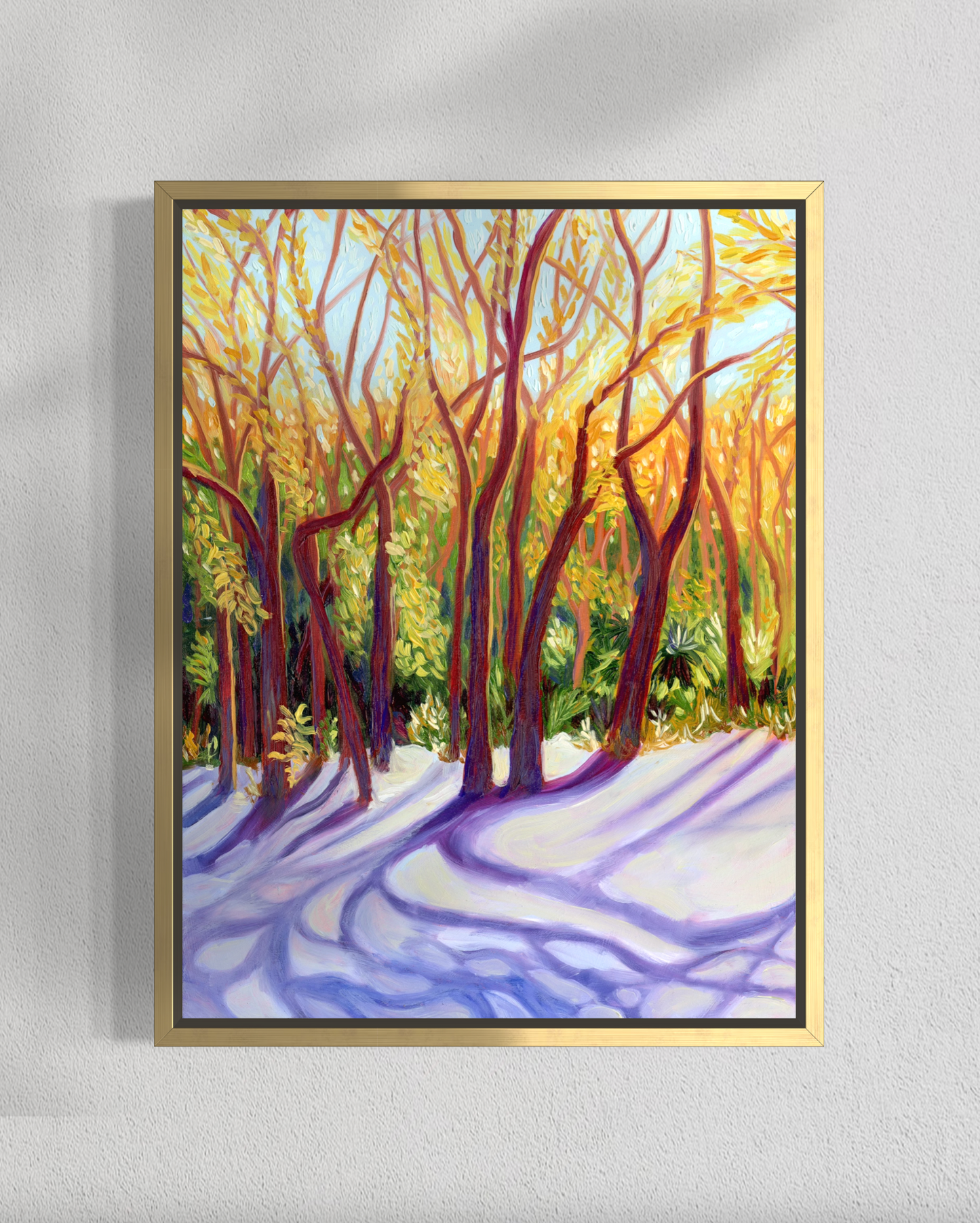 Framed painting of a forest scene with trees and snow on a light gray background