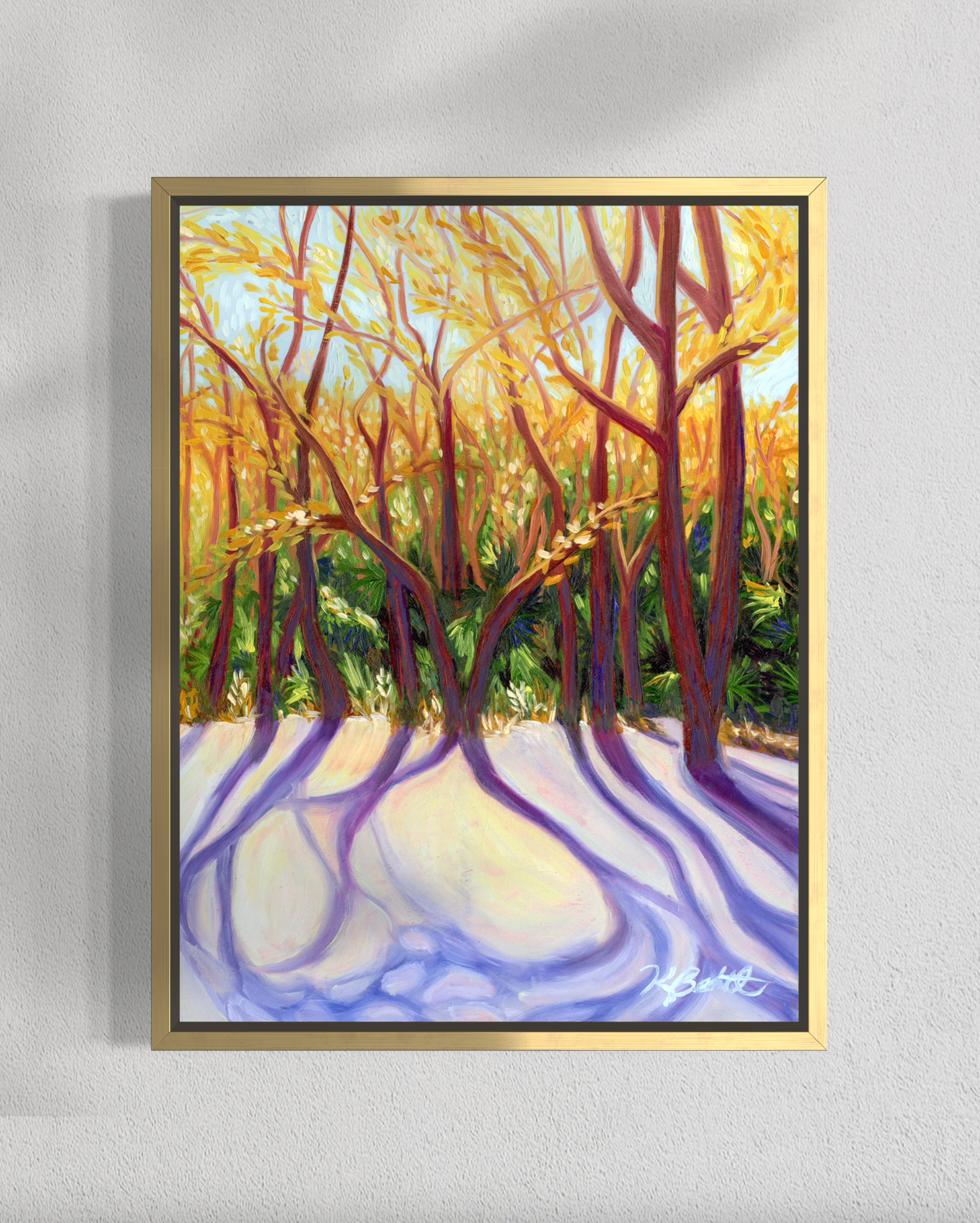 Framed painting of a forest scene with trees and a path on a gray wall.