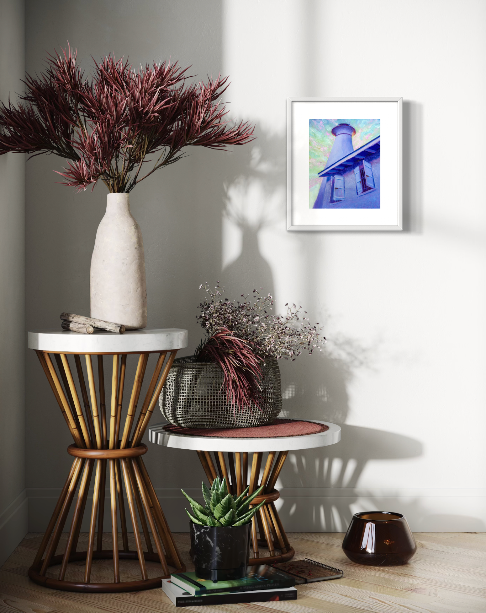 Decorative setup with a vase, plants, and framed artwork on a wall.