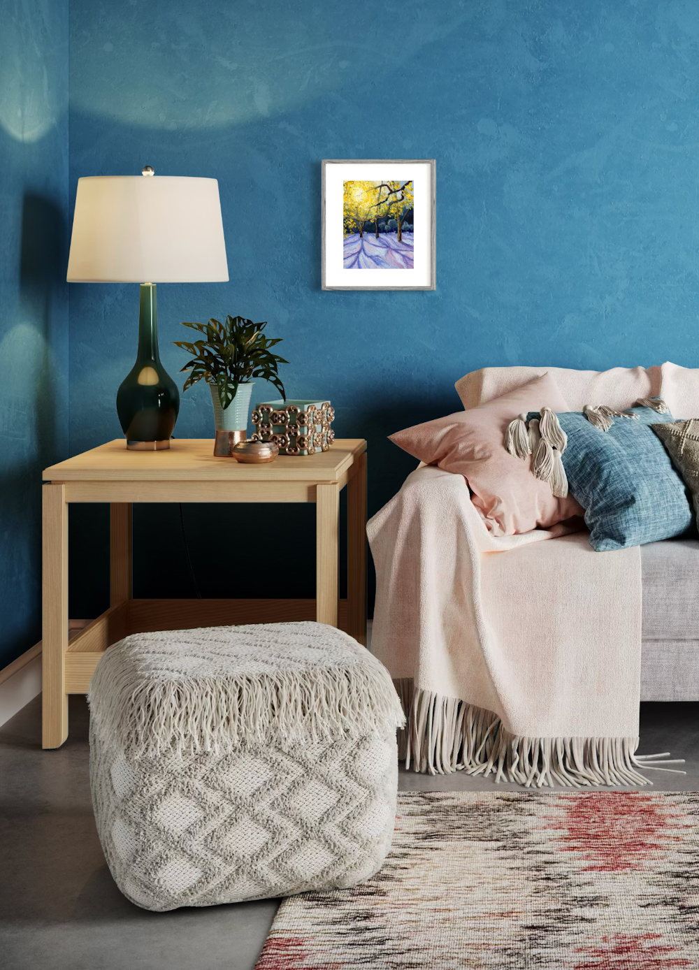 Cozy living room with a blue wall, lamp, plant, and decorative items.