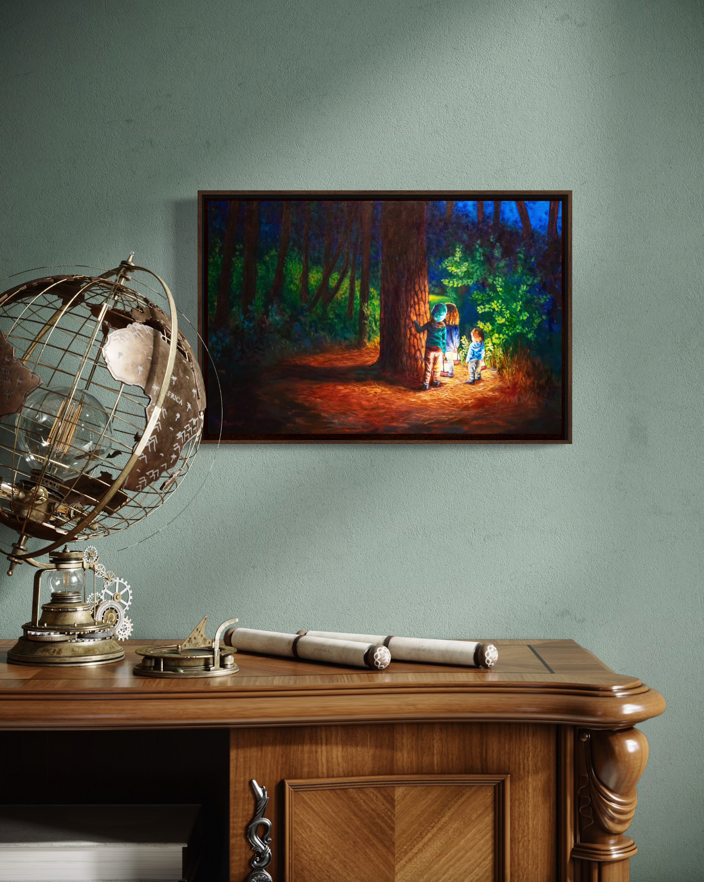 Framed artwork of a forest scene with three figures on a wall above a wooden desk.