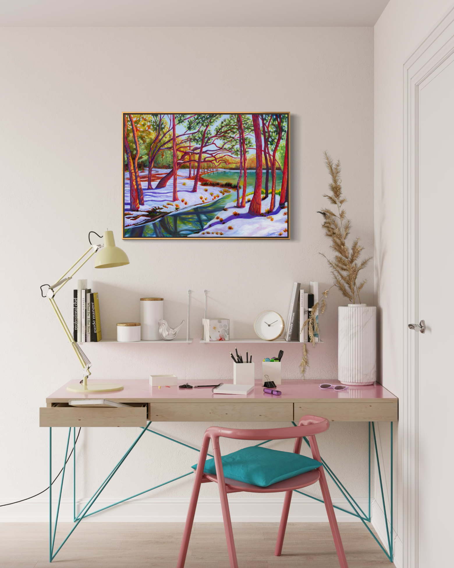 Modern home office with a desk, chair, and wall art.