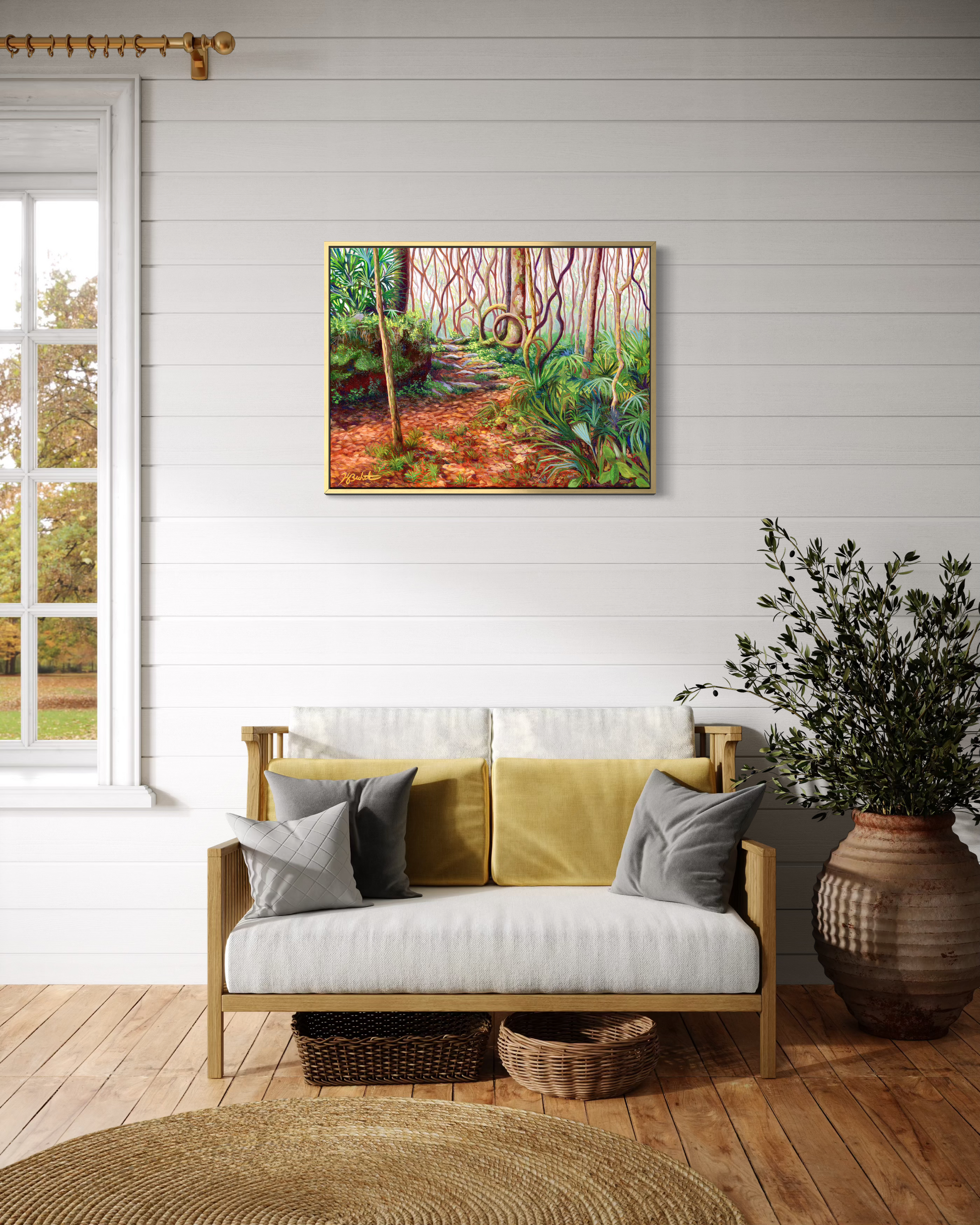 Living room with a yellow sofa, gray pillows, and a forest painting on the wall.