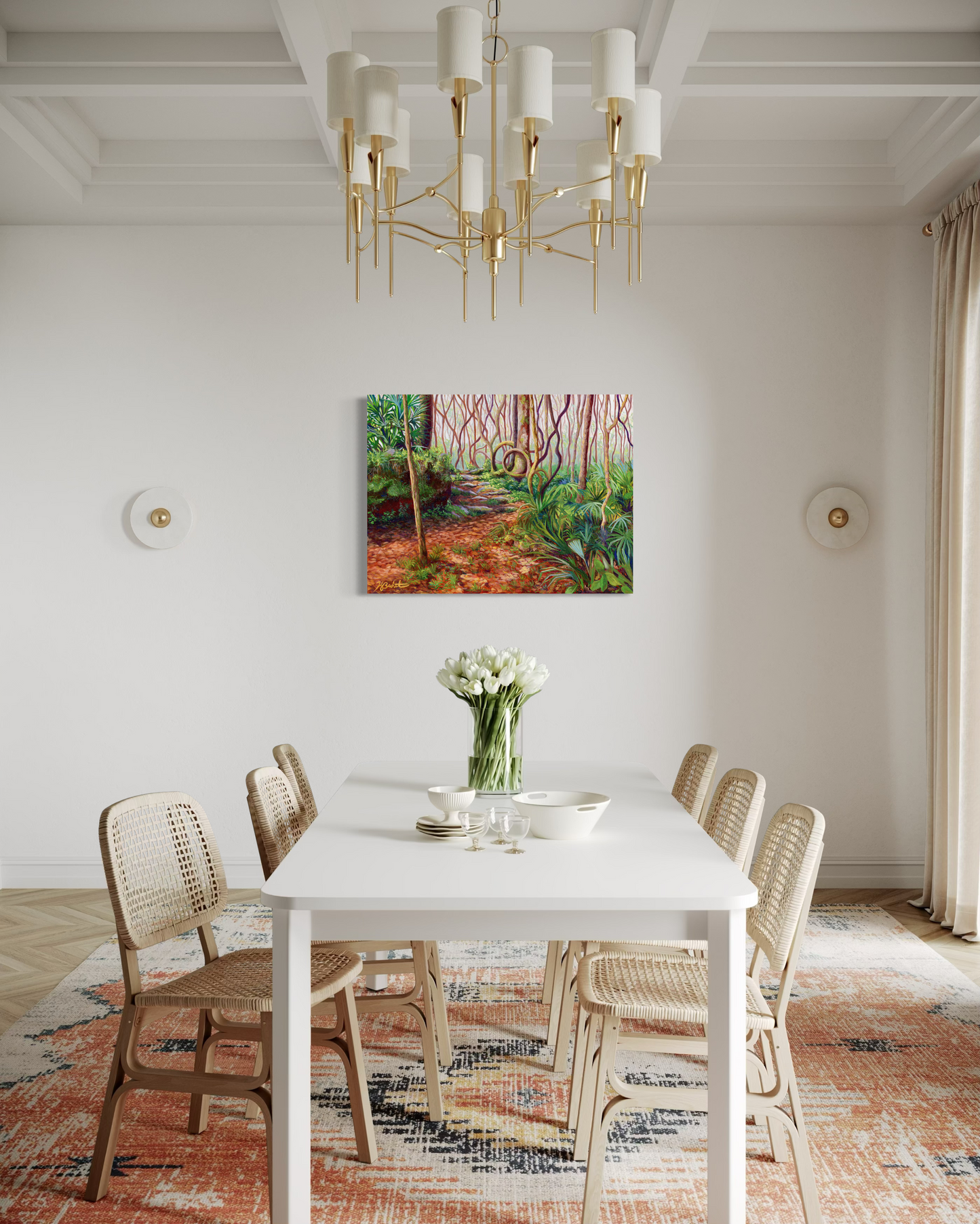 Dining room with a white table, wicker chairs, and a painting of a forest on the wall.