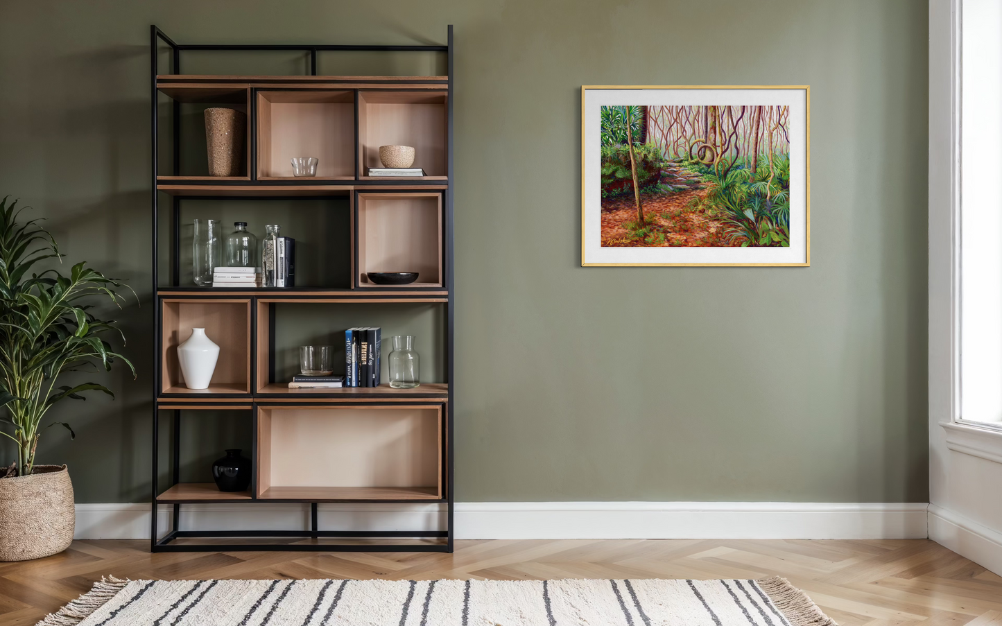 Room interior with a bookshelf, plant, and framed painting on a green wall.